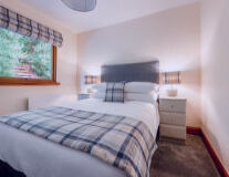 a bedroom with a large bed in a room a bedroom with a large bed in a room